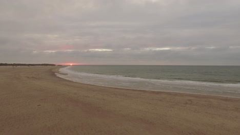Aerial:-An-overcast-beach-during-sunset-in-the-Netherlands