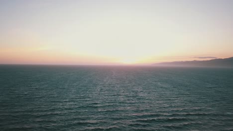 Drone-shot-of-sunset-over-pacific-ocean-at-Venice-beach-Los-Angeles