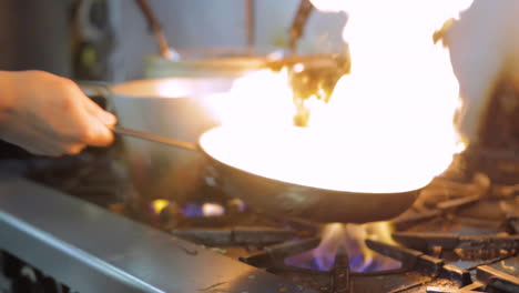 Fire-in-a-hot-pan-in-a-restaurant's-kitchen