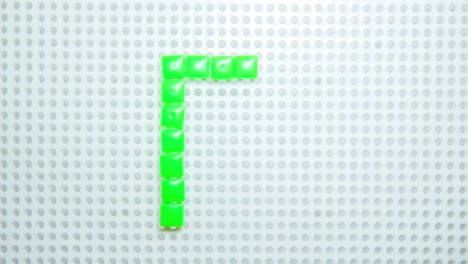 Stoppbewegung-Des-Buchstabens-R,-Der-Jeweils-Ein-Pixel-Erstellt,-Hergestellt-Mit-Kinderspielzeug