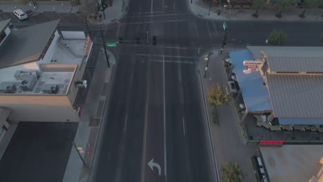 AERIAL---Tilt-Up-Drone-Shot-of-Downtown's-Main-Road