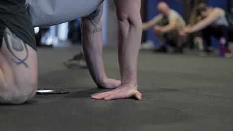 Various-shots-of-an-athlete-and-equipment-in-a-CrossFit-gym