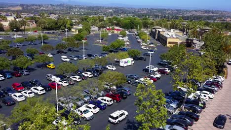 Aerial-fly-through-of-a-shopping-mall-strip-mall-parking-lot-shot1