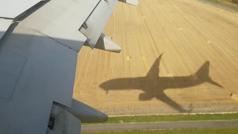 Jet-airplane-landing-shadow-on-the-ground