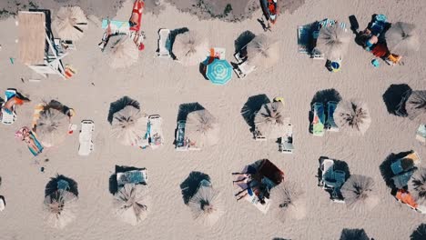 beach-umbrellas-on-a-black-sea-shot-from-high-during-a-vacation