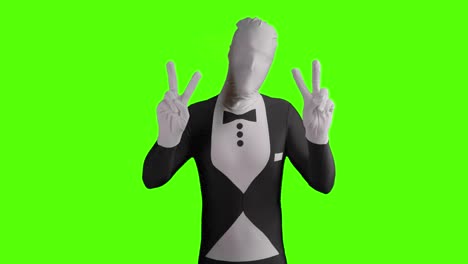 Static-shot-of-a-business-morphsuit-demonstrating-for-peace-and-holding-peace-sign-into-camera-with-both-hands-in-front-of-green-background
