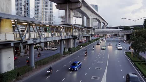 Skywalk-connecting-the-sky-train-station-on-the-main-road-in-Lat-Phrao-area,-Bangkok,-Thailand