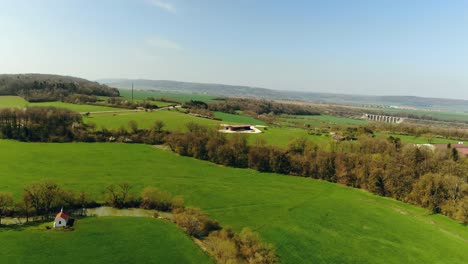Drone-shot-of-the-wide-green-Farmfield