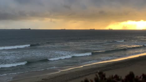 4k-60p,-Golden-sunset-on-the-ocean-with-cargo-ships-on-the-horizon