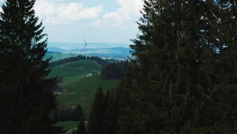 aerial-view-of-single-windmill-in-the-swiss-countryside,-renewable-energy-from-wind-power-turbines