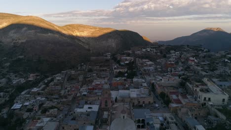 Aerial-panning-down-shot-of-Real-de-Catorce-in-the-morning,-San-Luis-Potosi-Mexico