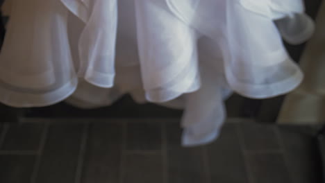 Bridal-wedding-dress-hanging-on-a-hanger