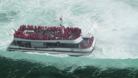 Looking-Down-Towards-Maid-of-the-Mist-Boat-Cruise-Tour-in-Niagara-Falls,-Canada-High-Angle-Static-Shot-from-Above-Looking-Over-the-Brink-of-the-Waterfall