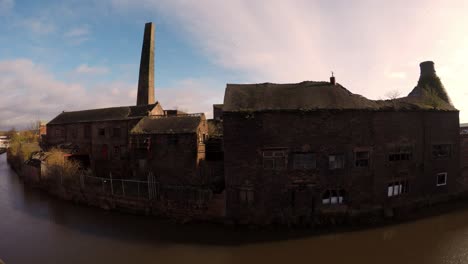 Aerial-footage-of-an-old-abandoned,-derelict-pottery-factory-and-bottle-kiln-located-in-Longport,-Stoke-on-Trent,-Staffordshire