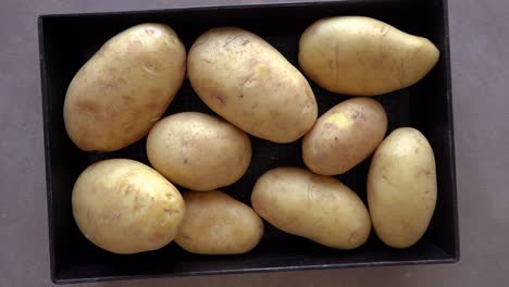 Fresh-Unpeeled-Potatoes-In-A-Container.-overhead-shot