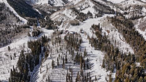 Park-City-Utah-Aerial-v68-drone-fly-towards-red-pine-lodge-white-pine-canyon,-tilt-down-birds-eye-view-at-skiers-waiting-for-gondola-cable-car-to-lift-uphill---Shot-with-Mavic-3-Cine---February-2022