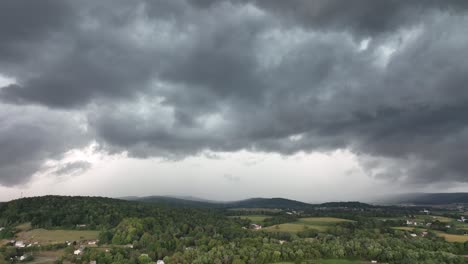 A-rising-aerial-view-of-a-big-rainstorm-moving-over-the-countryside