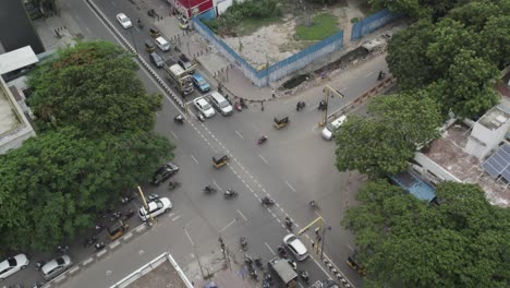 Aerial-shot-of-traffic-signal-with-Cars,-Auto,-Bikes-and-Other-transport-moving-in-the-city
