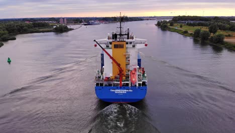 Tracking-Shot-From-Rear-Side-Of-Tailwind-Panda-Container-Ship-Cruising-Oude-Maas-River,-Netherlands