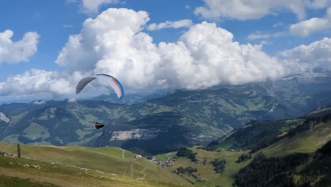 Paraglider-in-the-swiss-alps-taking-off