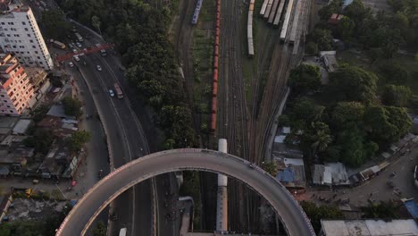 Top-down-aerial-drone-view-of-busy-trafficated-flyover-road-in-Dhaka,-Bangladesh
