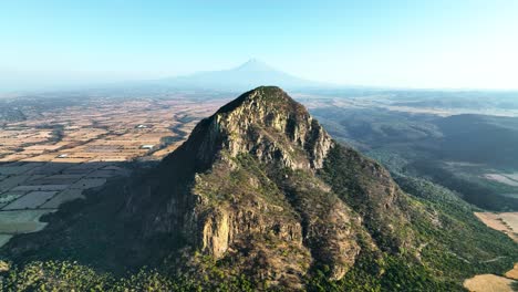 Tall-Mountain-Peak-of-Cerro-del-Chumil-in-Morelos,-Mexico---Aerial-Flight