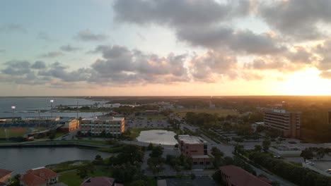 Drone-shot-over-historic-downtown-Pensacola-in-Florida-near-Blue-Wahoos-stadium-at-sunset