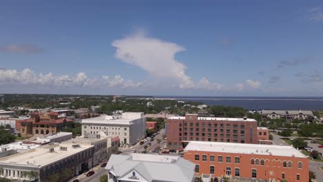 Drone-shot-over-historic-downtown-Pensacola-in-Florida-on-a-partly-cloudy-and-sunny-day
