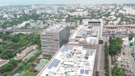 Aerial-shot-of-corporate-buildings-filled-with-solar-panels-to-self-sustain-electricity