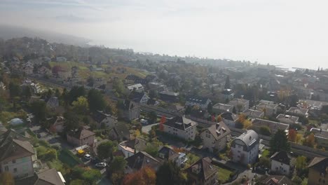 Drone-panoramic-view:-Residential-area-in-Lausanne-town:-Houses,-buildings,-roads-and-garden-in-the-capital-city-in-Vaud,-Switzerland