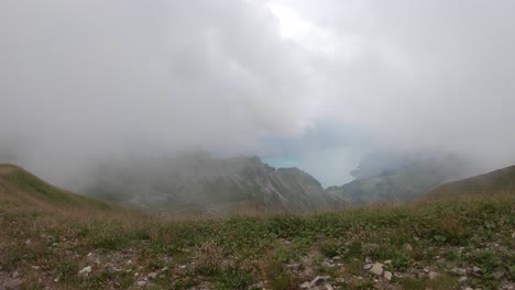 Alpine-landscape-of-Brienz-Lake,-Switzerland-from-Rothorn-cog-train-on-misty-day