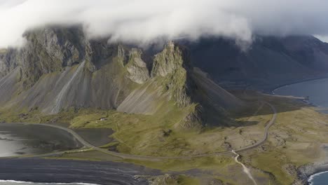 Eystrahorn-Mountain-Covered-With-White-Clouds-In-Iceland---aerial-shot