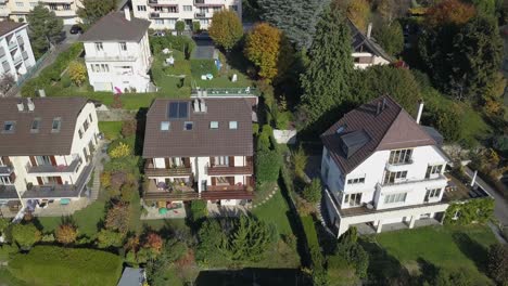 Drone-aerial-view:-neighbourhood-in-Lausanne-town:-Houses-and-trees-in-the-capital-city-in-Vaud,-Switzerland