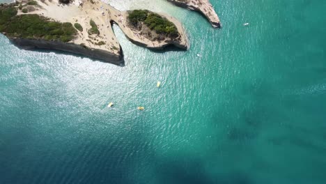 Aerial-top-down-clear-sea-ocean-pristine-water-with-luxury-boat-moored-in-corfu-Greece-europe-travel-holiday-destination