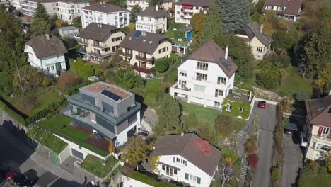 Drone-push-out:-Lausanne,-residential-neighborhood-in-the-town,-trees-and-houses,-urban-environment,-Switzerland,-Vaud,-aerial-view