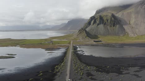 Aerial-View-Of-Vestrahorn-Road-In-Iceland-On-A-Cloudy-Day---drone-shot