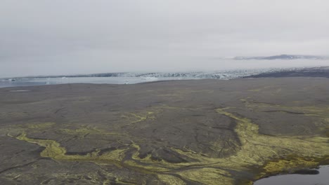 Aerial-approaching-shot-of-Breidamerkurjökul-Glacier-in-Iceland-at-cloudy-day