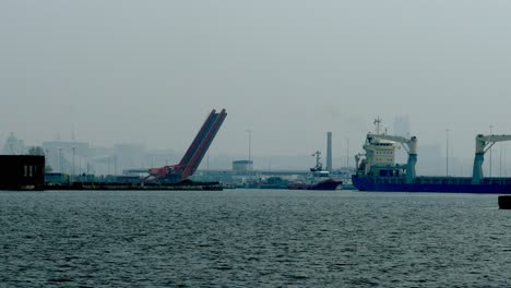 timelapse-Bridge-lowering-after-tugboat-helps-ship-navigate-through-dock-gate