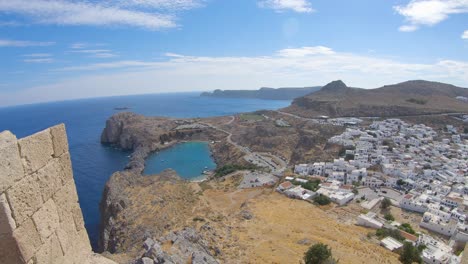 Showing-an-amazing-view-from-an-acropolis-down-to-a-white-ancient-village-called-lindos