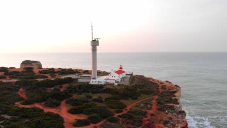 Drone-shot-rotates-around-lighthouse-in-day-time