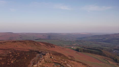 Aerial-Drone-tracking-over-cliffs-at-sunset-in-Peak-District-United-Kingdom
