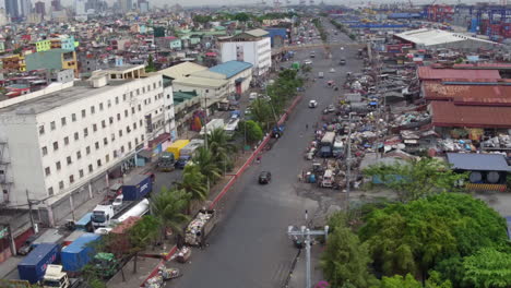 Aerial-Shot-Of-A-Busy-Highway-In-A-Squatters-Area-In-Manila-4K