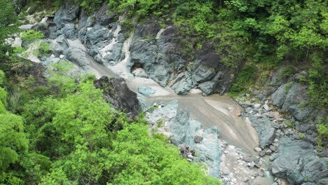 Flying-On-Los-Charcos-de-Nizao-Riverbed-In-Tropical-Forest-Near-San-Cristobal,-Dominican-Republic