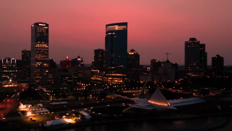 Slow-Aerial-Pan-Forward-Of-Downtown-Milwaukee-With-A-Bright-Sunset