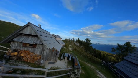 Fpv-footage-was-filmed-in-the-Slovenian-mountain-village-in-the-alps-with-a-drone-flying-fast-over-mountains-filmed-with-a-GoPro-with-surrounding-landscapes-flying-between-and-over-small-wooden-cabins-7