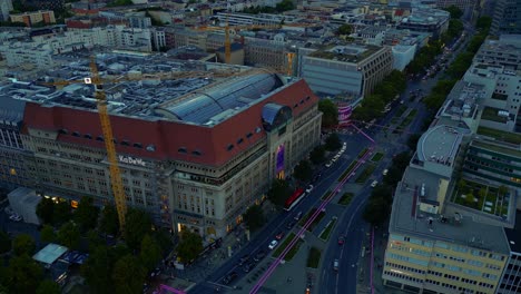 Buttery-soft-aerial-view-flight-panorama-orbit-drone-of-Department-store-KaDeWe-on-Wittenberg-Place-in-Berlin-Germany-at-summer-evening-September-2022