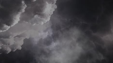 Flying-through-dark-cumulonimbus-clouds-in-the-dark-sky-4k