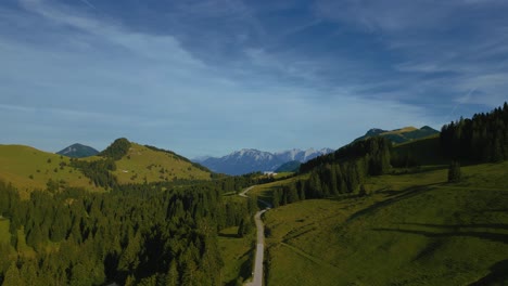 Bavarian-Austrian-Sudelfeld-Wendelstein-alps-mountain-peaks-with-romantic-and-lush-green-grass-meadows-and-panorama-view-road