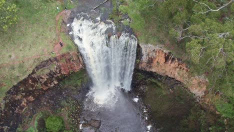 Drone-footage-of-water-flowing-over-the-Trentham-Falls-after-rain-on-22-Sepember,-2021,-Victoria,-Australia