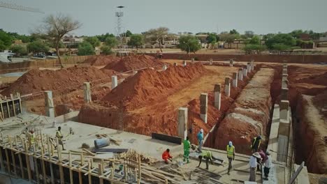 Cinematic-Forward-Drone-Shot-of-Power-Plant-Construction-Site-in-Niger,-Africa